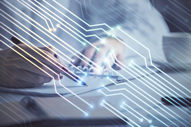 multi exposure of woman's writing hand on background with data technology hologram concept of innovation