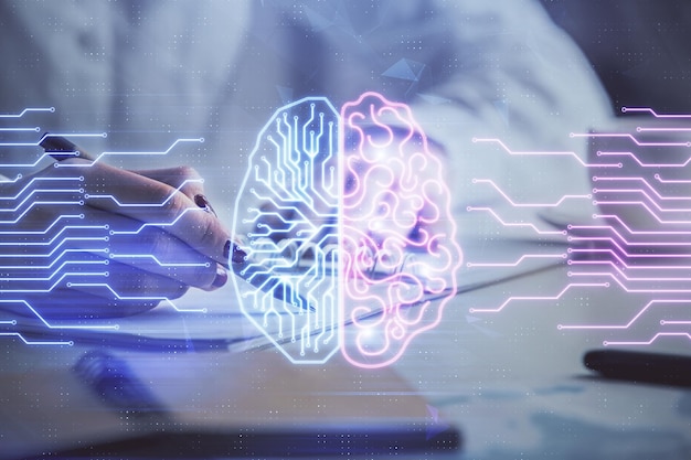 Multi exposure of womans writing hand on background with brain hologram Concept of brainstorming