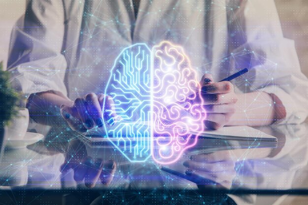 Multi exposure of writing hand on background with brain hologram Concept of self learning