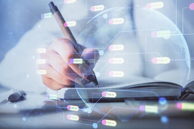 Multi exposure of writing hand on background with data technology hologram Concept of innovation