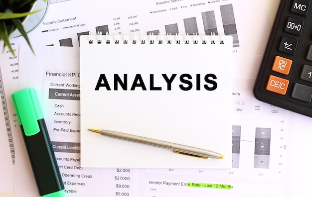 notepad with text analysis on a white background. business concept.