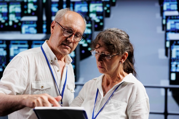 Old coworkers monitoring data center