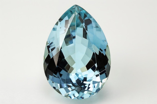 One aquamarine pear cut gemstone on white background front view