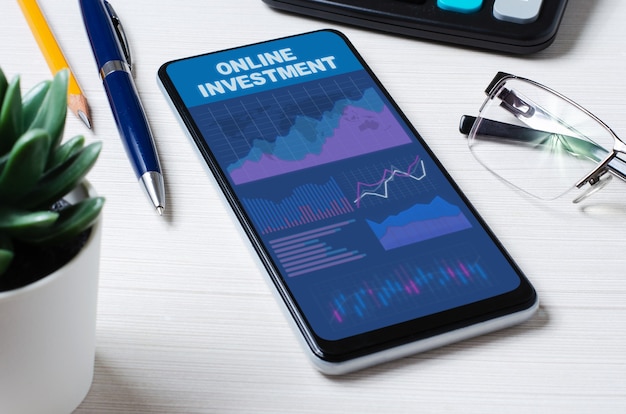 Online investment. Smartphone with a mobile app on the background of graphs and charts.