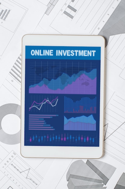Online investment. Tablet with a mobile app with graphs and charts. Analysis of business processes or exchange trading.