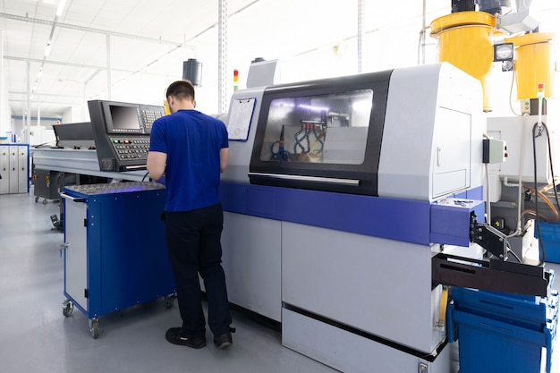 Operator of metal processing equipment in factory