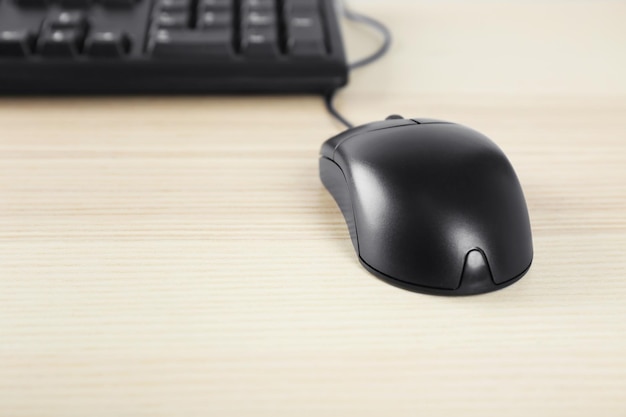 Optical mouse and computer keyboard on table