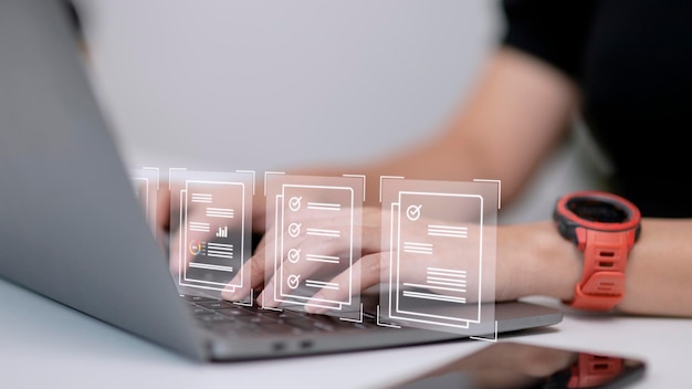 Paperless workplace ideas esigning electronic signature document management A businessman signs an electronic document on a digital document on a virtual screen