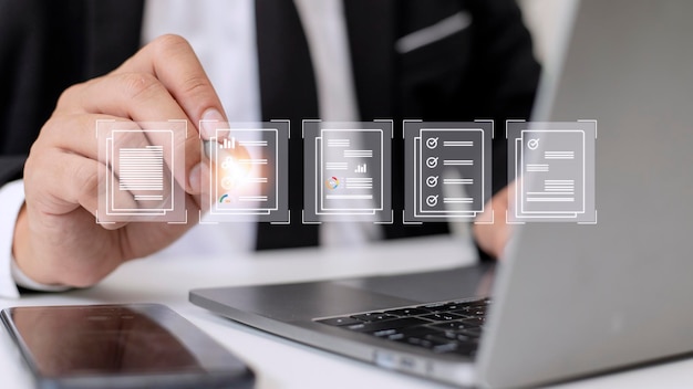 Paperless workplace ideas esigning electronic signature document management A businessman signs an electronic document on a digital document on a virtual screen