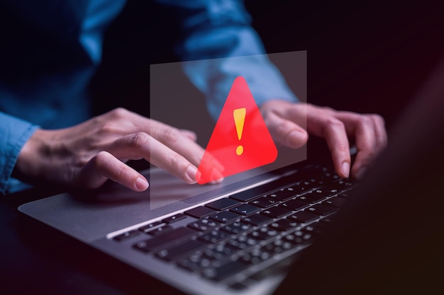 People with warning notification and spam message icon on laptop