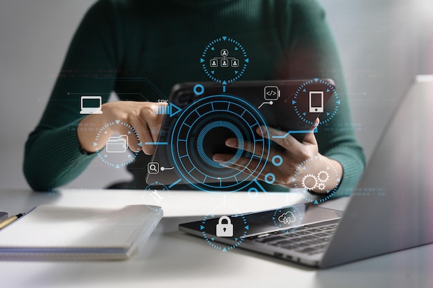 Person using smartphone tablet with SDK icon on virtual screen SDK Software development kit programming language technology concept in office