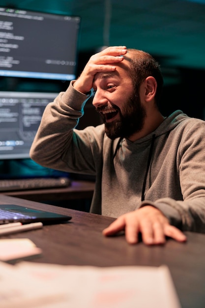 Pleased smiling coder celebrating data script success, feeling happy about programming source code on computer. Cheerful web developer enjoying coding achievement after hours, ai network.