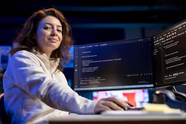 Portrait of smiling IT professional working from home developing software