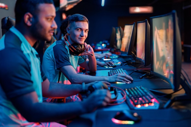 Professional gamer participates in team play in cyber club