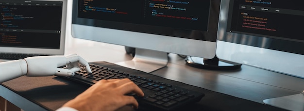 Program coding automation by generative artificial intelligence or AI concept Collaboration between robotic hand and human software developer solving debugging or writing scriptTrailblazing