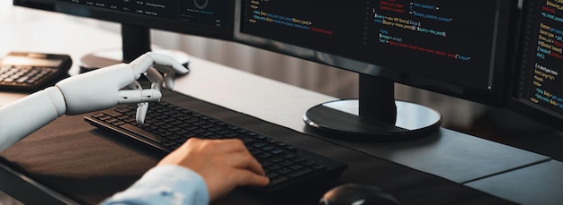 Program coding automation by generative artificial intelligence or AI concept Collaboration between robotic hand and human software developer solving debugging or writing scriptTrailblazing