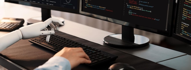 Program coding automation by generative artificial intelligence or AI concept Collaboration between robotic hand and human software developer solving debugging or writing scriptTrailblazing