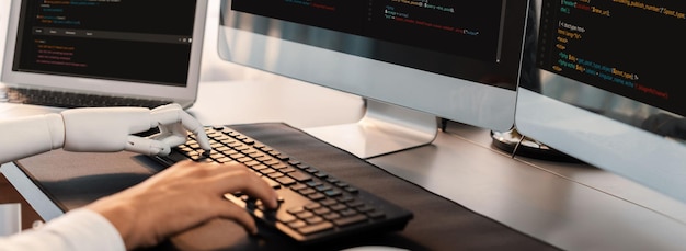 Program coding automation by generative artificial intelligence or AI concept Collaboration between robotic hand and human software developer solving debugging or writing scriptTrailblazing