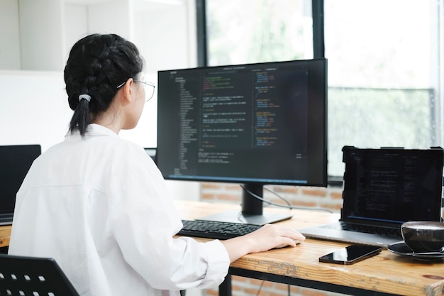 programmer coding and developing software or application project