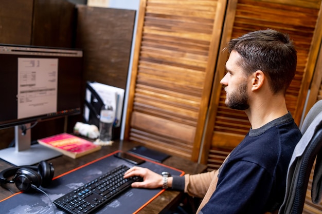 Programmer working in a software development company office while looking at the screen and writing code Website design concept