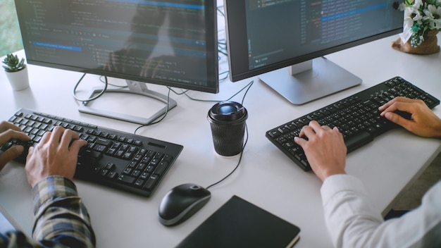 Programmers developing codes on their computers