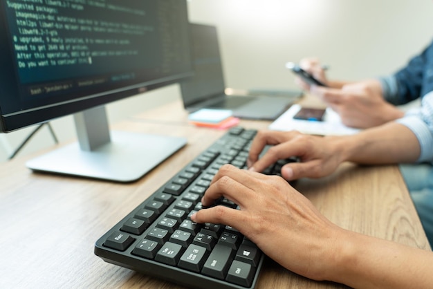 Programmers using computers in office