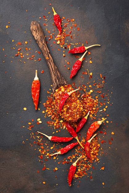 Red hot chili peppers on rusty background
