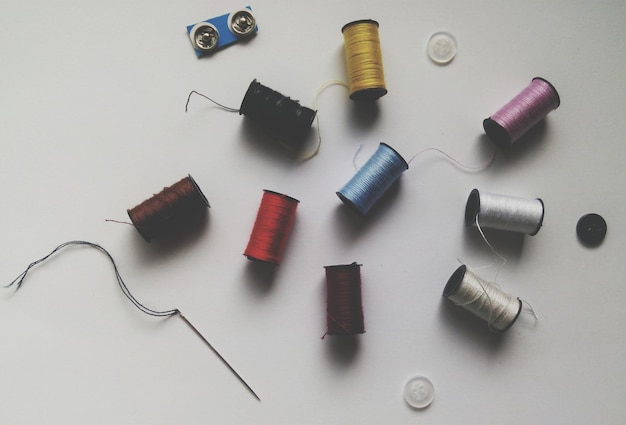Reels of thread over white background
