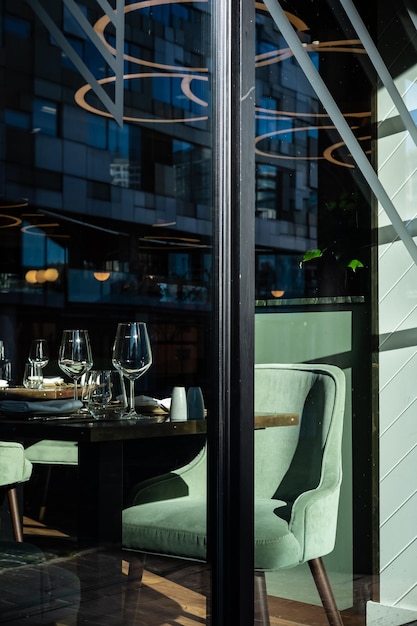 Reflection of glass window on table at restaurant