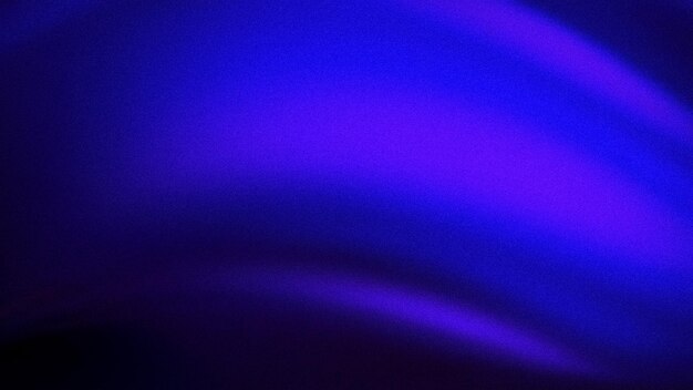 Rich gradient blend of deep blue and purple hues with a grainy texture offering a captivating background ideal for creative digital designs and wallpapers