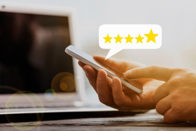 Satisfied customers rate the product or service online with five stars concept