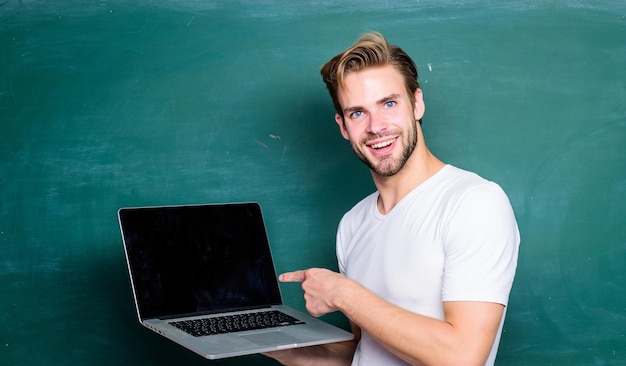 School teacher programming with laptop Handsome man use modern technology Digital technology Apply online course for programmers Student learn programming language Programming web development