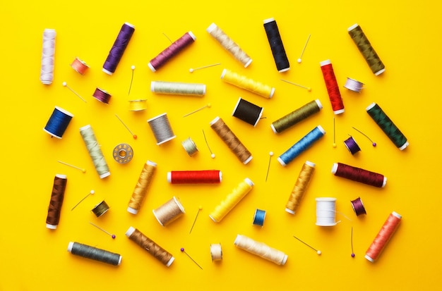 Sewing equipment on yellow background