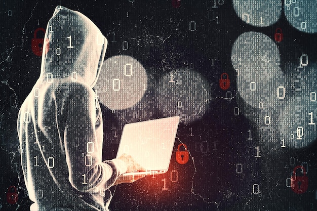 Side view of hacker in hoodie using laptop while standing on abstract dark hacking background with bokeh circles and binary coding Malware and phishing data theft concept