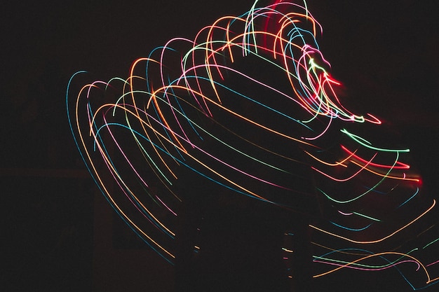Silhouette woman amidst illuminated light painting