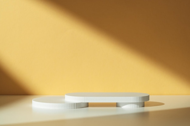 simple minimalist white geometric shapes on a light orange background in natural lighting