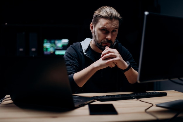 Skillful hacker working on computers
