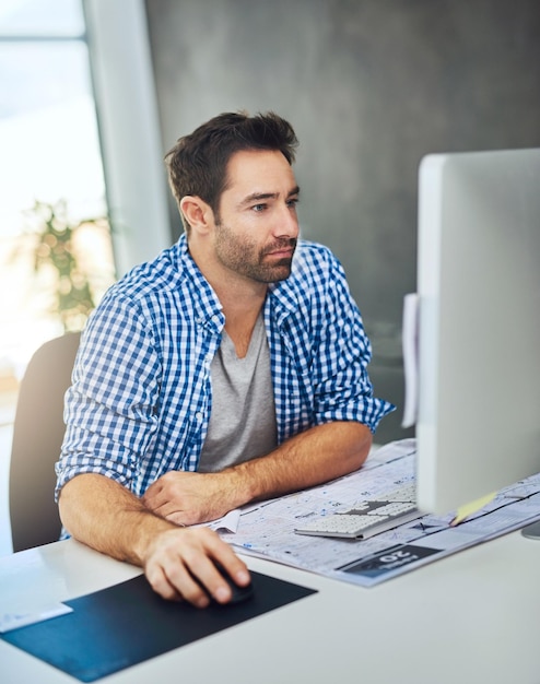 Small business man and graphic designer on computer for startup website programming or software Typing online and creative editing at media agency on desktop for digital test research or skills