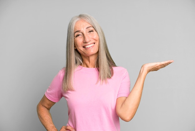 smiling feeling confident successful and happy showing concept or idea on copy space on the side