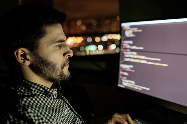 software developer computer at dark home office startup and hard working concept