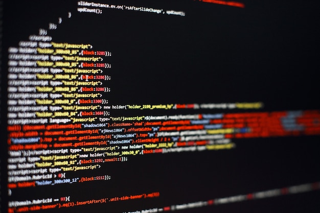 Software developer programming code. Abstract computer script code. Selective focus
