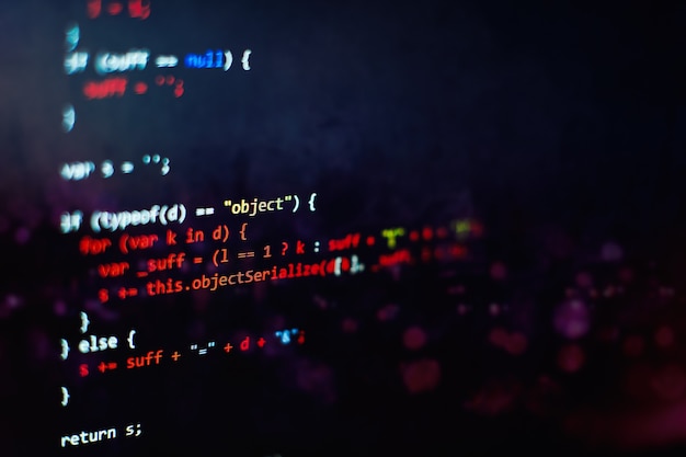 Software developer programming code. Abstract computer script code. Selective focus