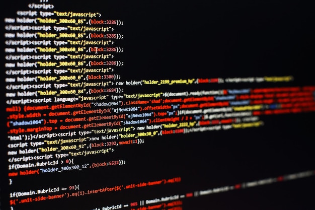 Software developer programming code. Abstract computer script code. Selective focus