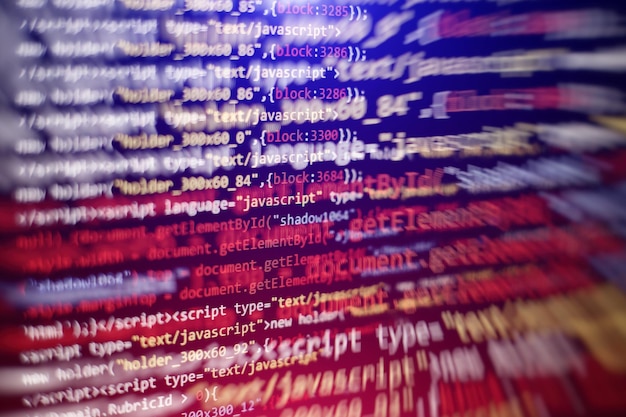 Software developer programming code. Abstract computer script code. Selective focus