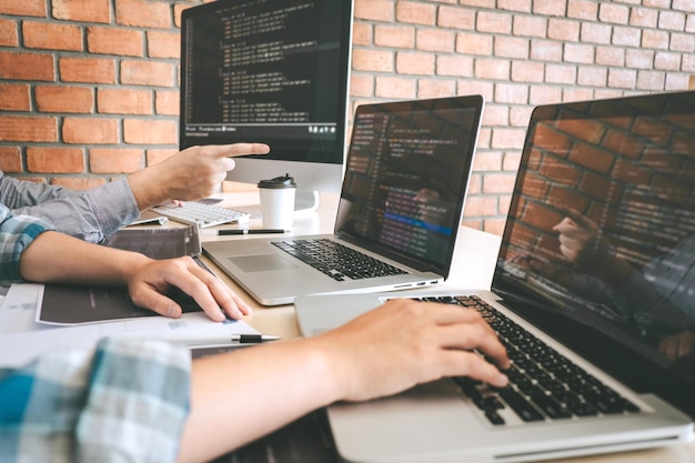 Software developers using laptop
