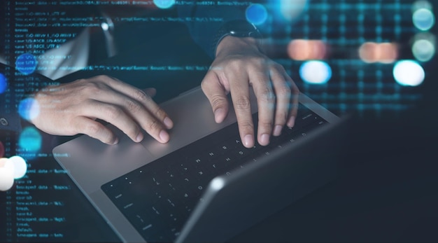 Software development digital technology concept Coding programmer software engineer working on laptop with circuit board and javascript on virtual screen internet of things IoT