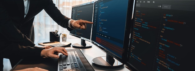 Software development team working together in office coding script display on computer monitor Programmer and software engineer working in tech developer company Trailblazing