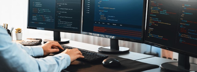 Software engineer working on application development on his computer display code and script on monitor at tech company office workplace Application developer solving and writing code Trailblazing