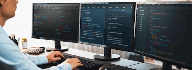 Software engineer working on application development on his computer display code and script on monitor at tech company office workplace Application developer solving and writing code Trailblazing
