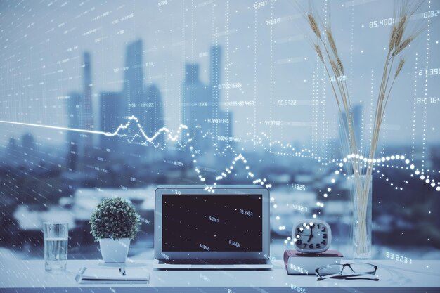Stock market graph on background with desk and personal computer Double exposure Concept of financial analysis